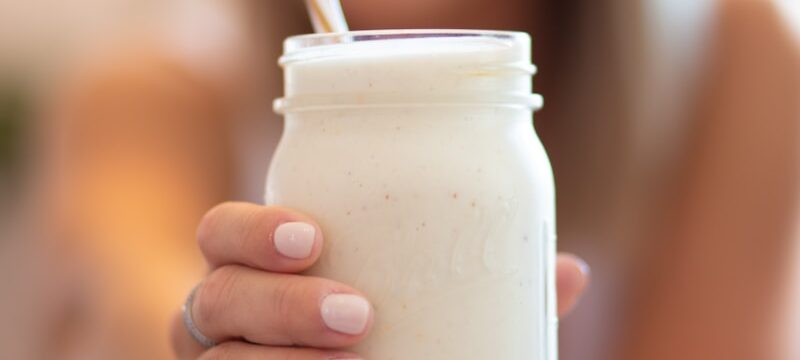 woman holding glass jar
