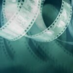 retro film, 35mm film, perforated, negative on pink background, with shadow, photo film, vintage film, film photography, analog film, vintage photography, retro photo