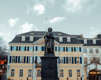 Historic Beethoven Monument in Bonn's town square with classic architecture.