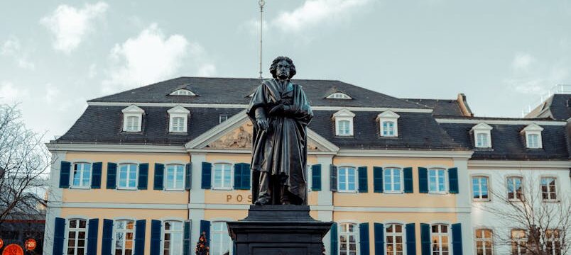 Historic Beethoven Monument in Bonn's town square with classic architecture.